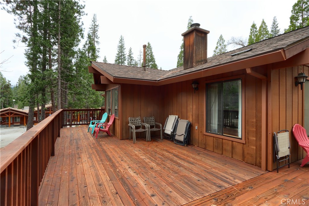 8041 Chilnualna Falls Road Wawona, CA 95389 - Photo 31 of 46 a view of a deck with wooden floor and seating space