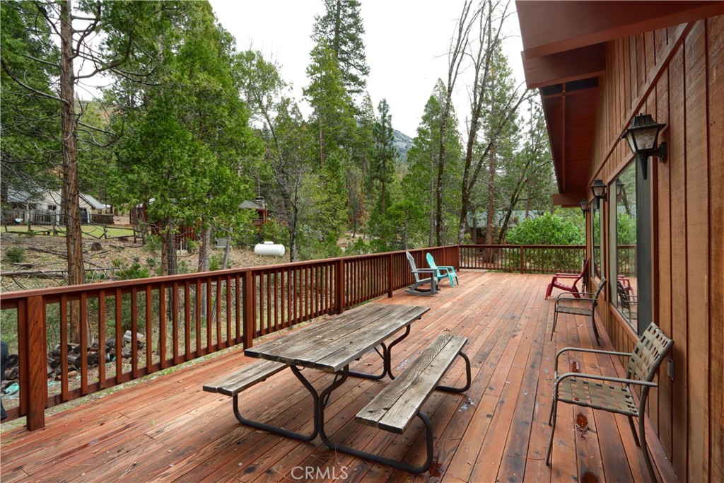 8041 Chilnualna Falls Road Wawona, CA 95389 - Photo 33 of 46 a view of backyard with a patio and wooden floor