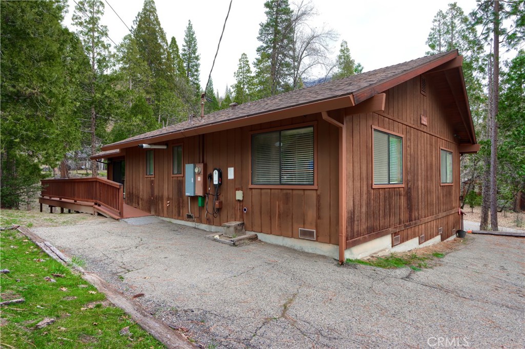 8041 Chilnualna Falls Road Wawona, CA 95389 - Photo 36 of 46 a view of a house with backyard and trees