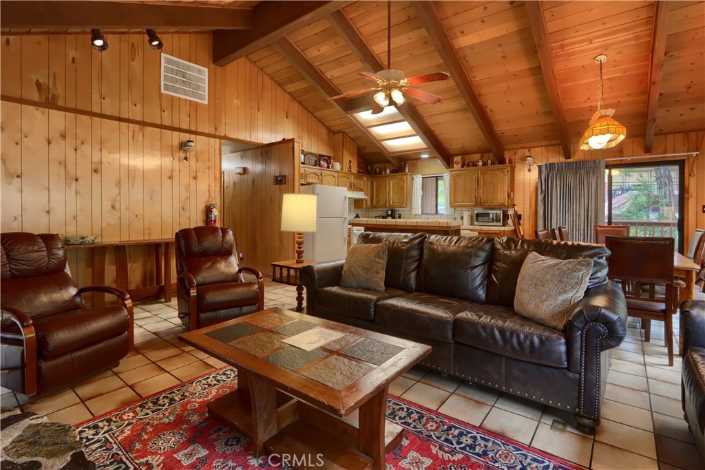 8041 Chilnualna Falls Road Wawona, CA 95389 - Photo 6 of 46 a media room with lots of chairs and a table