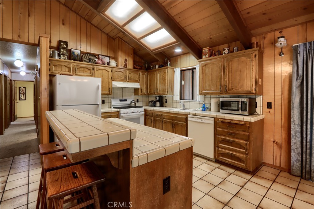 8041 Chilnualna Falls Road Wawona, CA 95389 - Photo 9 of 46 a kitchen with a sink appliances and cabinets