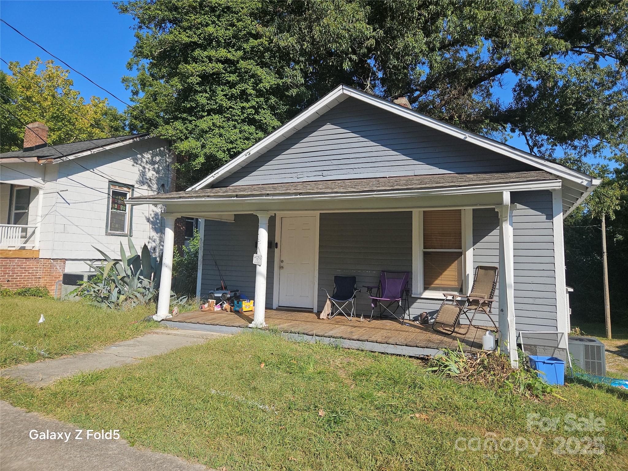 a view of house with yard outdoor seating and entertaining space