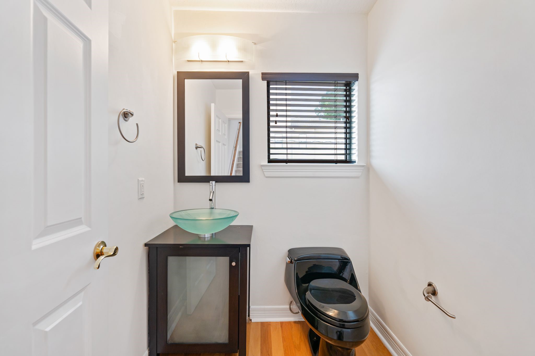 501 Detering Street Houston, TX 77007 - Photo 12 of 44 Powder bath tucked away on the landing heading upstairs.