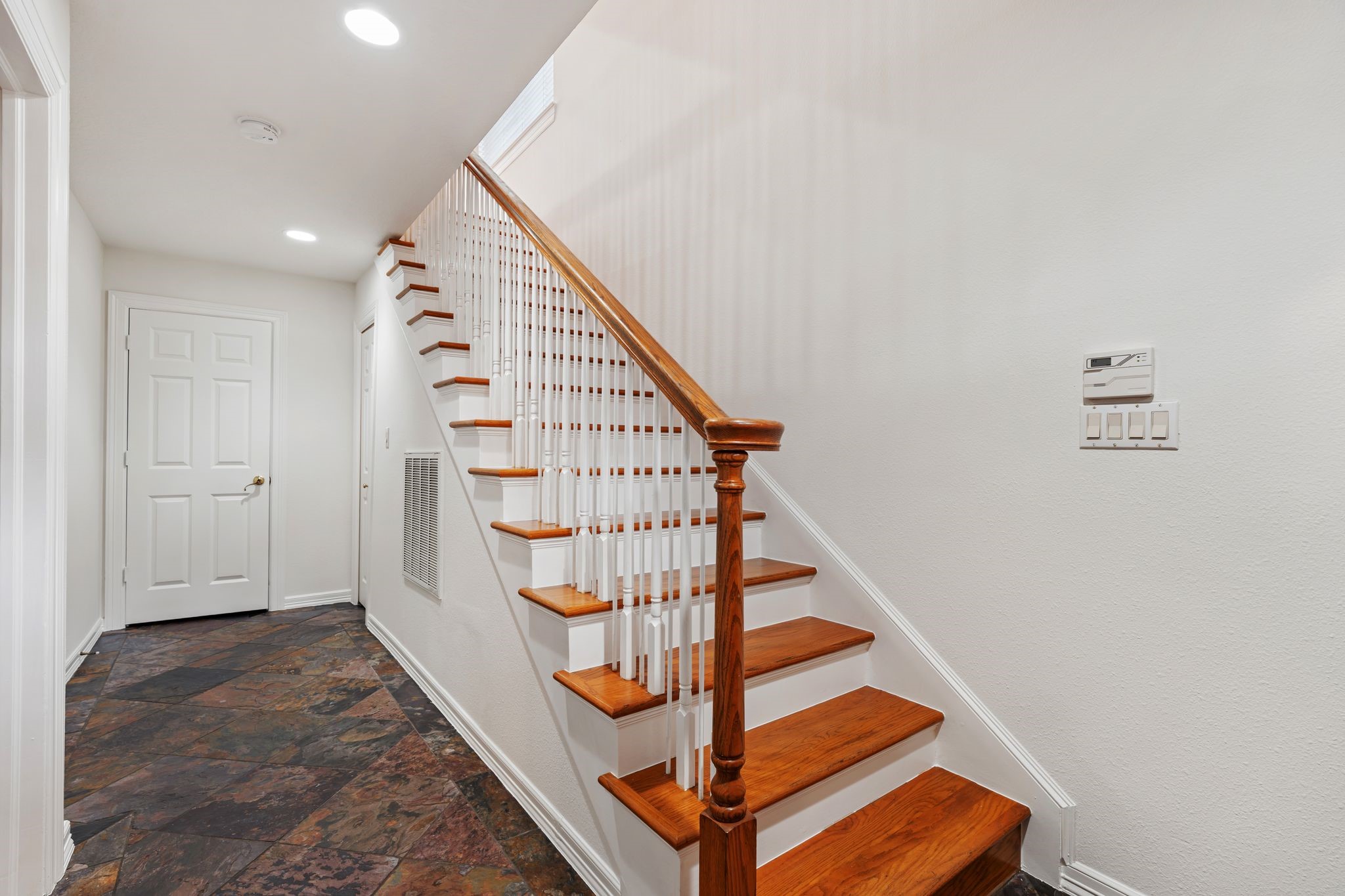 501 Detering Street Houston, TX 77007 - Photo 25 of 44 Heading downstairs - On the first floor, you’ll find the utility room, under-stair storage, and a secondary bedroom with an en suite bath and a large closet.