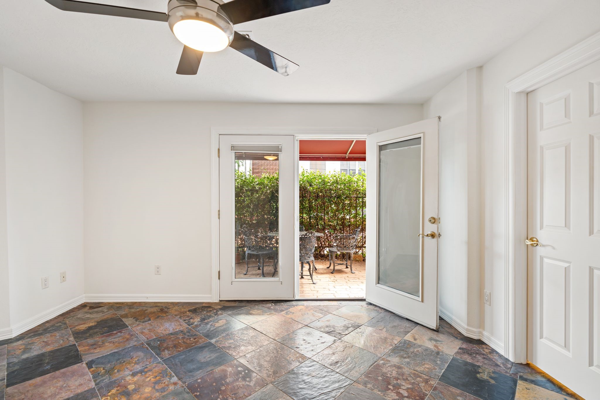 501 Detering Street Houston, TX 77007 - Photo 27 of 44 This is the first floor bedroom with french door access to the covered seating area.