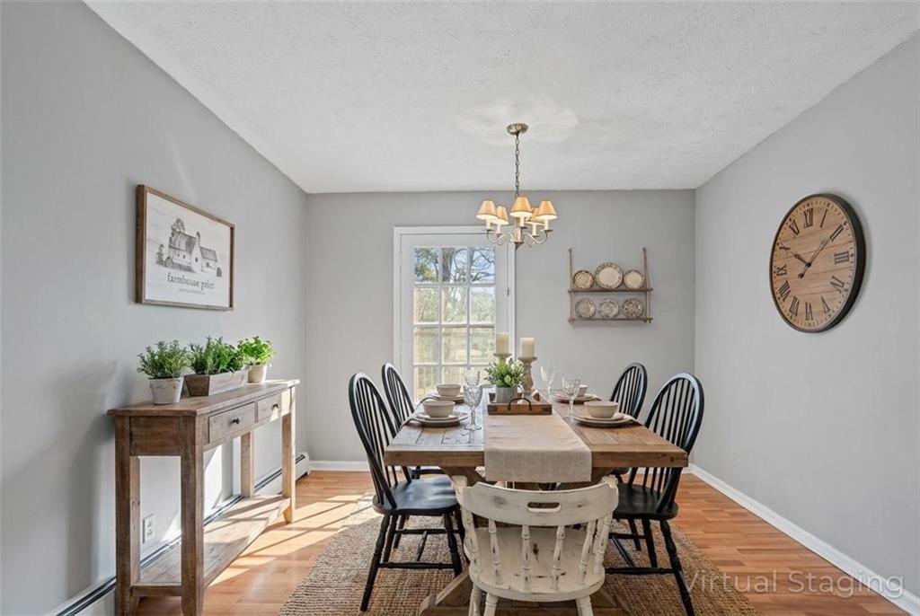 1021 Palm Street Canton, GA 30115 - Photo 14 of 31 a view of a dining room with furniture a chandelier and wooden floor