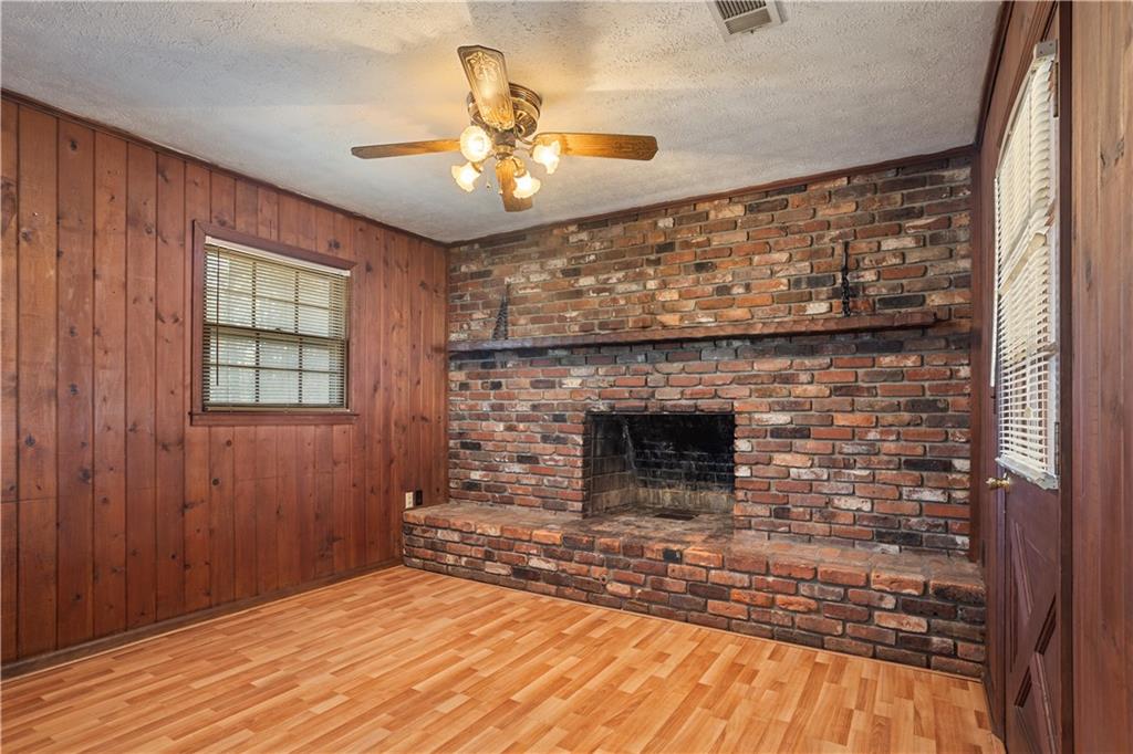 1021 Palm Street Canton, GA 30115 - Photo 19 of 31 a view of an empty room with a fireplace and a window
