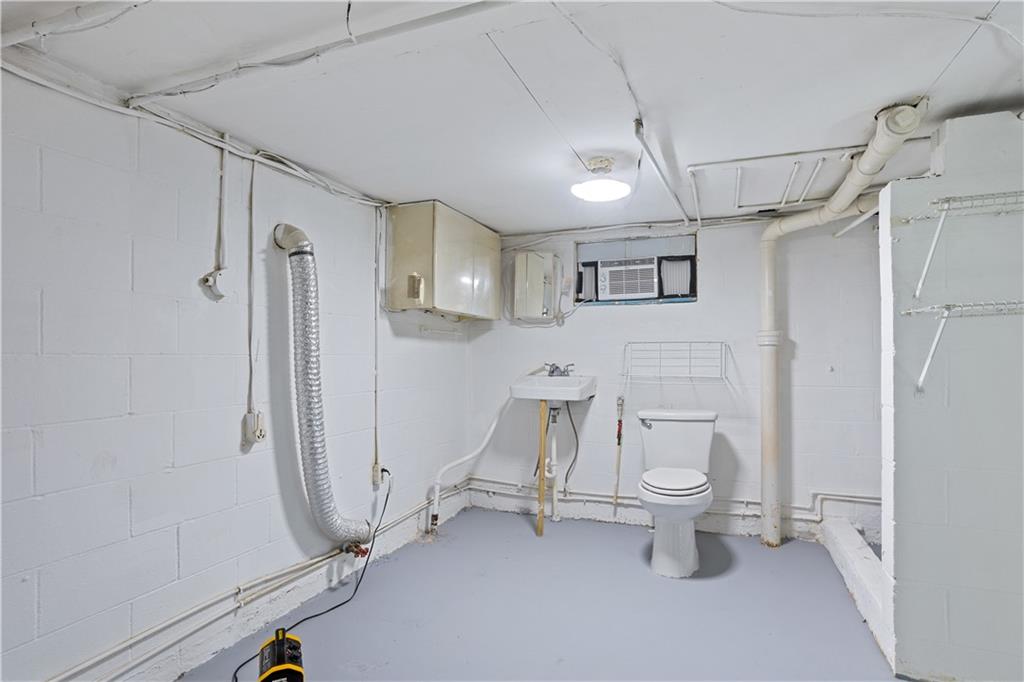 1021 Palm Street Canton, GA 30115 - Photo 26 of 31 a bathroom with a toilet and a shower