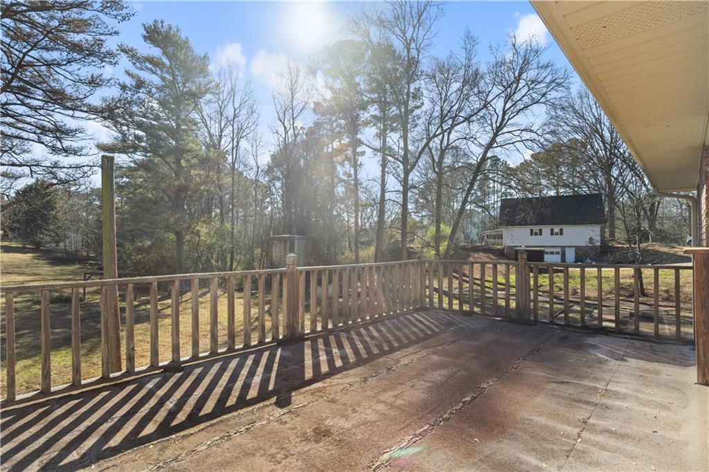 1021 Palm Street Canton, GA 30115 - Photo 27 of 31 a view of a roof deck with wooden fence and floor