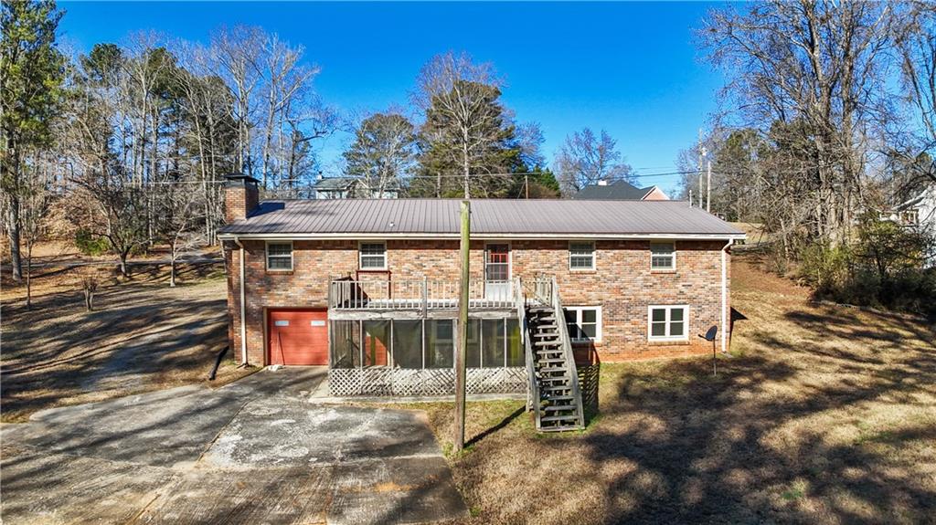 1021 Palm Street Canton, GA 30115 - Photo 30 of 31 a view of a house with yard and tree s
