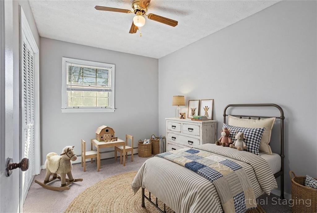 1021 Palm Street Canton, GA 30115 - Photo 6 of 31 a bedroom with a bed and a couch