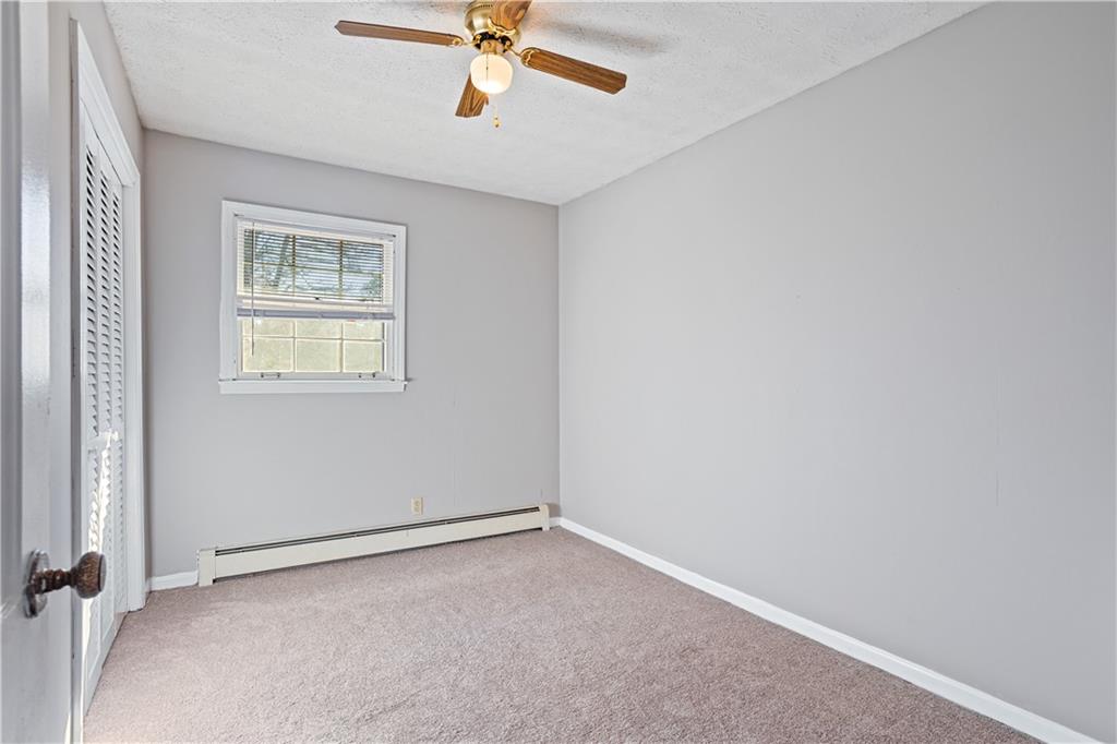 1021 Palm Street Canton, GA 30115 - Photo 7 of 31 an empty room with a window