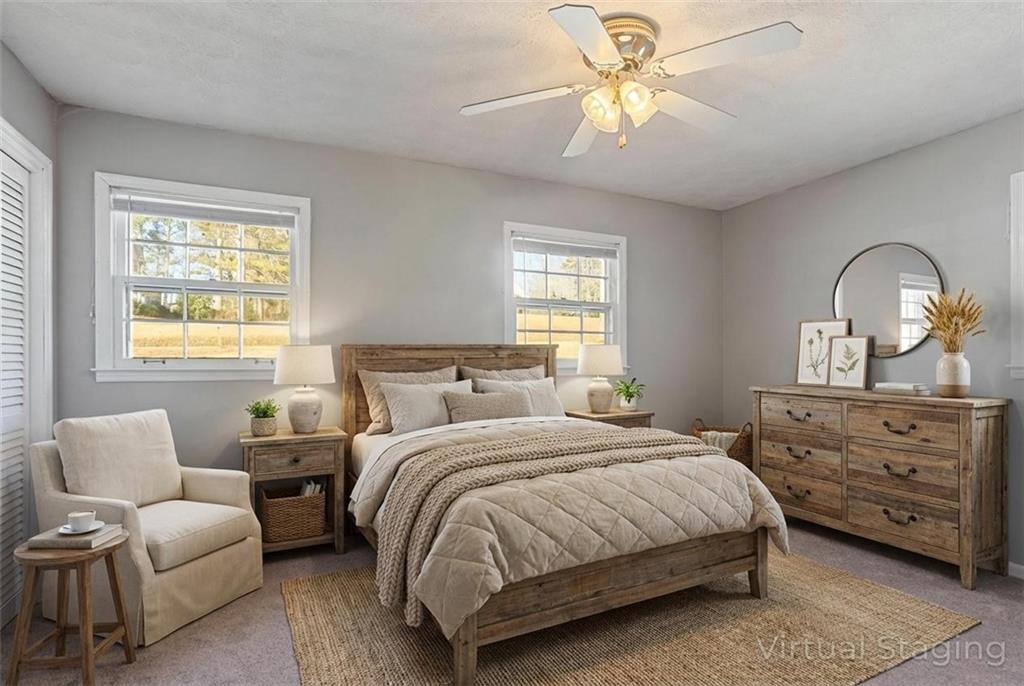 1021 Palm Street Canton, GA 30115 - Photo 10 of 31 a bedroom with a bed and a couch