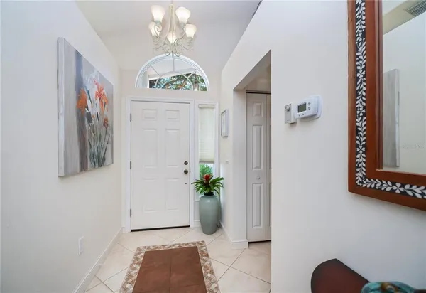 a view of hall way with furniture