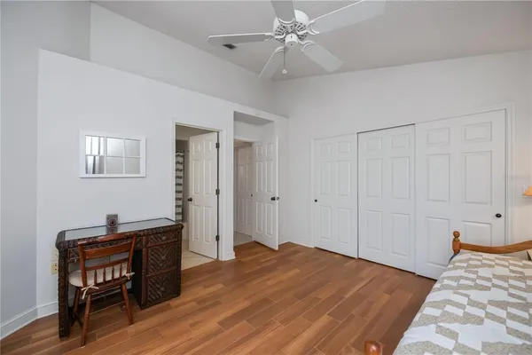 a bedroom with a bed and a dresser