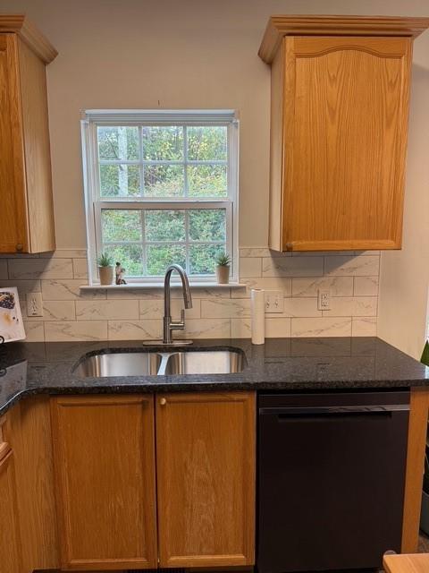 202 Reserve Crossing Canton, GA 30115 - Photo 20 of 56 a kitchen with granite countertop cabinets sink and window