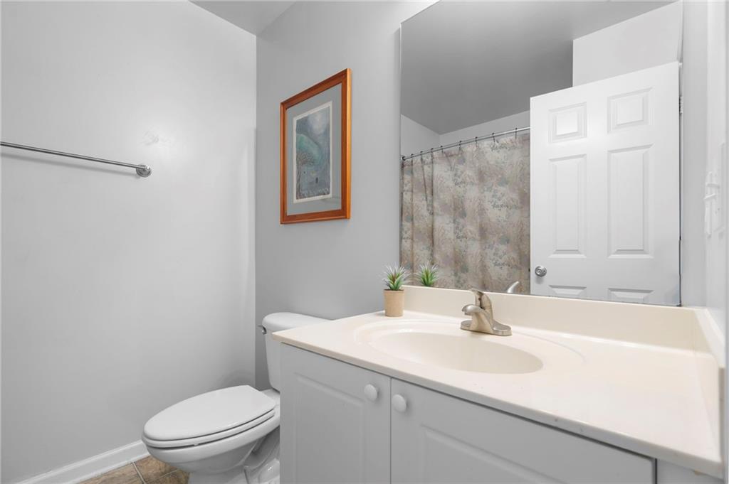 202 Reserve Crossing Canton, GA 30115 - Photo 25 of 56 a bathroom with a sink toilet and a mirror
