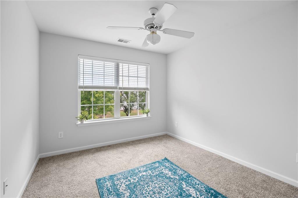 202 Reserve Crossing Canton, GA 30115 - Photo 28 of 56 a view of an empty room with a window