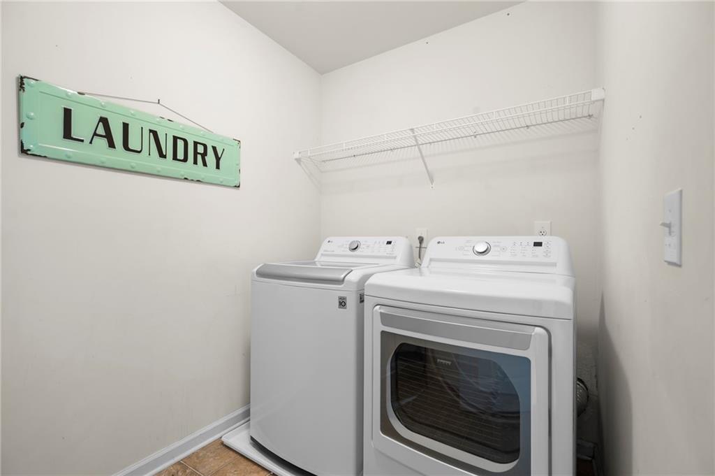 202 Reserve Crossing Canton, GA 30115 - Photo 30 of 56 a utility room with dryer and washer