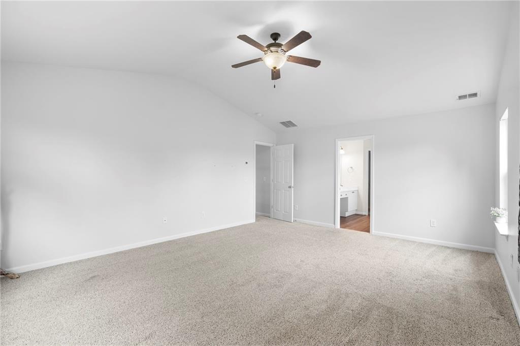 202 Reserve Crossing Canton, GA 30115 - Photo 32 of 56 an empty room with a ceiling fan and a ceiling fan