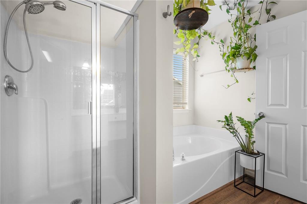 202 Reserve Crossing Canton, GA 30115 - Photo 35 of 56 a white bath tub with a shower