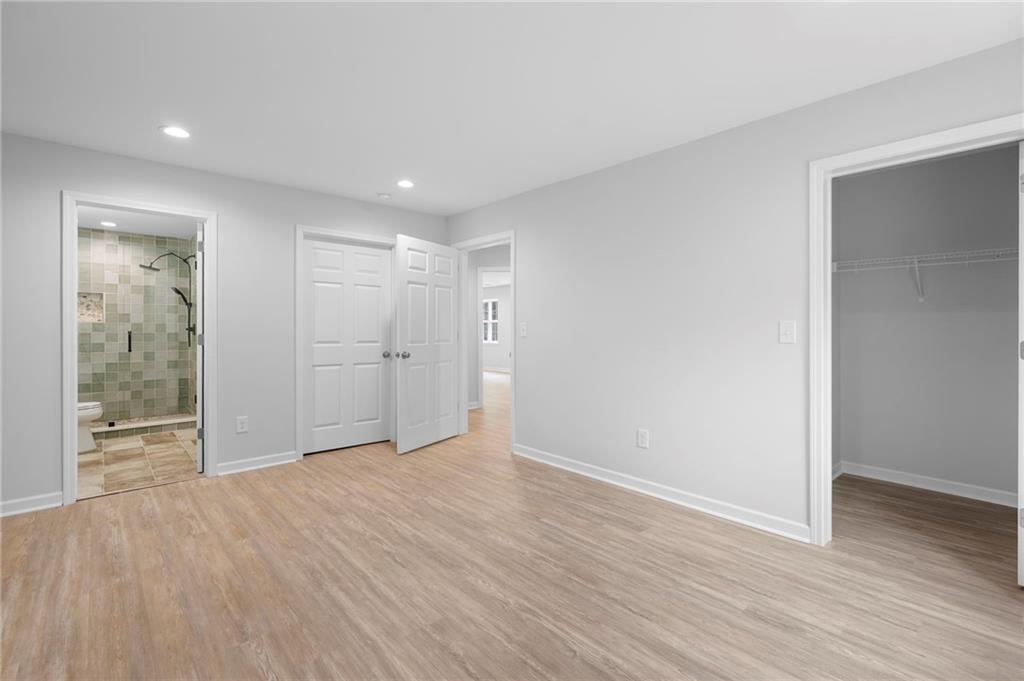 202 Reserve Crossing Canton, GA 30115 - Photo 38 of 56 a view of an empty room with wooden floor and windows
