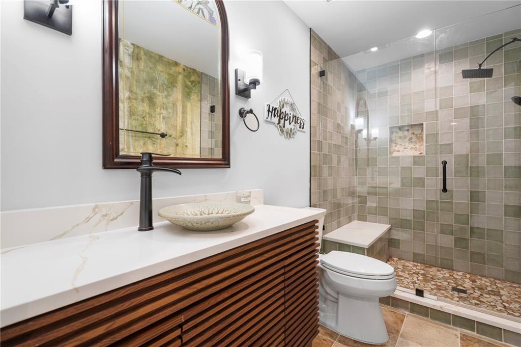 202 Reserve Crossing Canton, GA 30115 - Photo 39 of 56 a bathroom with a sink a toilet and shower