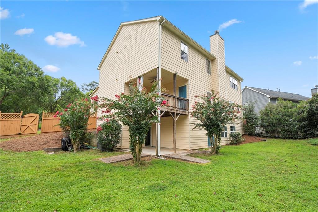 202 Reserve Crossing Canton, GA 30115 - Photo 45 of 56 a front view of house with a garden