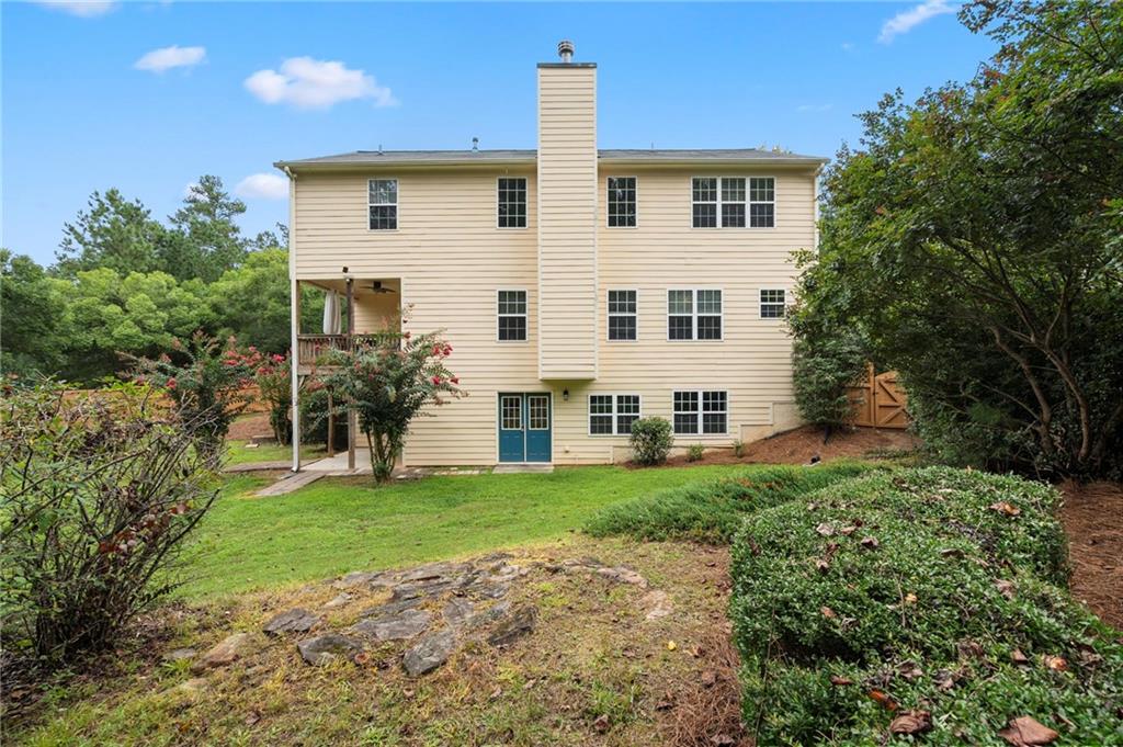 202 Reserve Crossing Canton, GA 30115 - Photo 47 of 56 a view of a house with a yard
