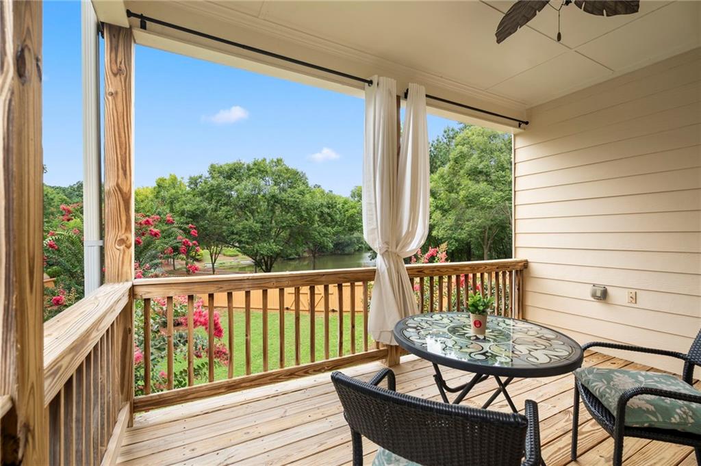 202 Reserve Crossing Canton, GA 30115 - Photo 50 of 56 a view of a chair in wooden deck