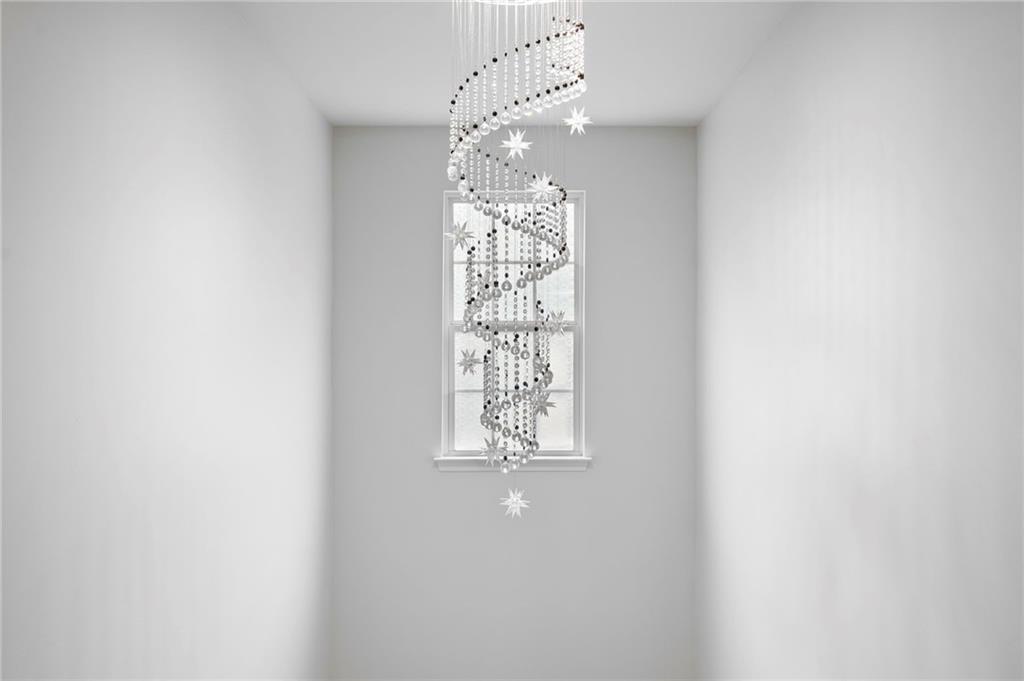 202 Reserve Crossing Canton, GA 30115 - Photo 7 of 56 a view of a chandelier in a room