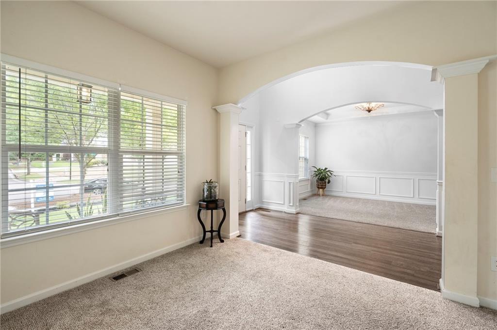 202 Reserve Crossing Canton, GA 30115 - Photo 9 of 56 a view of an empty room with a window