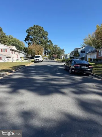 a kitchen with stainless steel appliances a sink stove refrigerator and cabinets