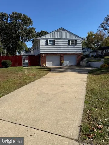 a view of a chairs and table in the backyard