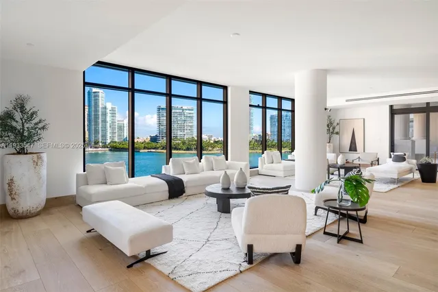 a view of living room with furniture and floor to ceiling window