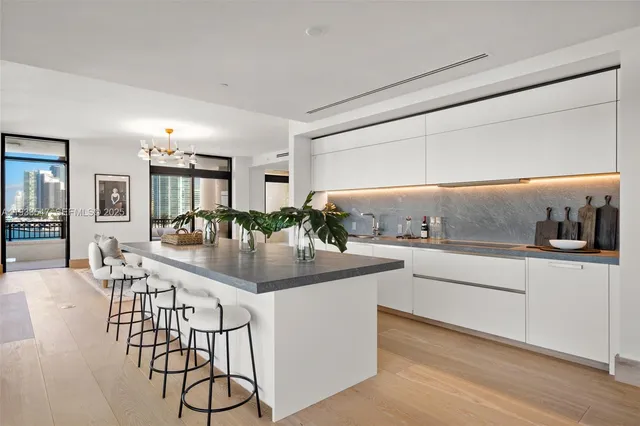 a bedroom with a bed and a large window with outer view