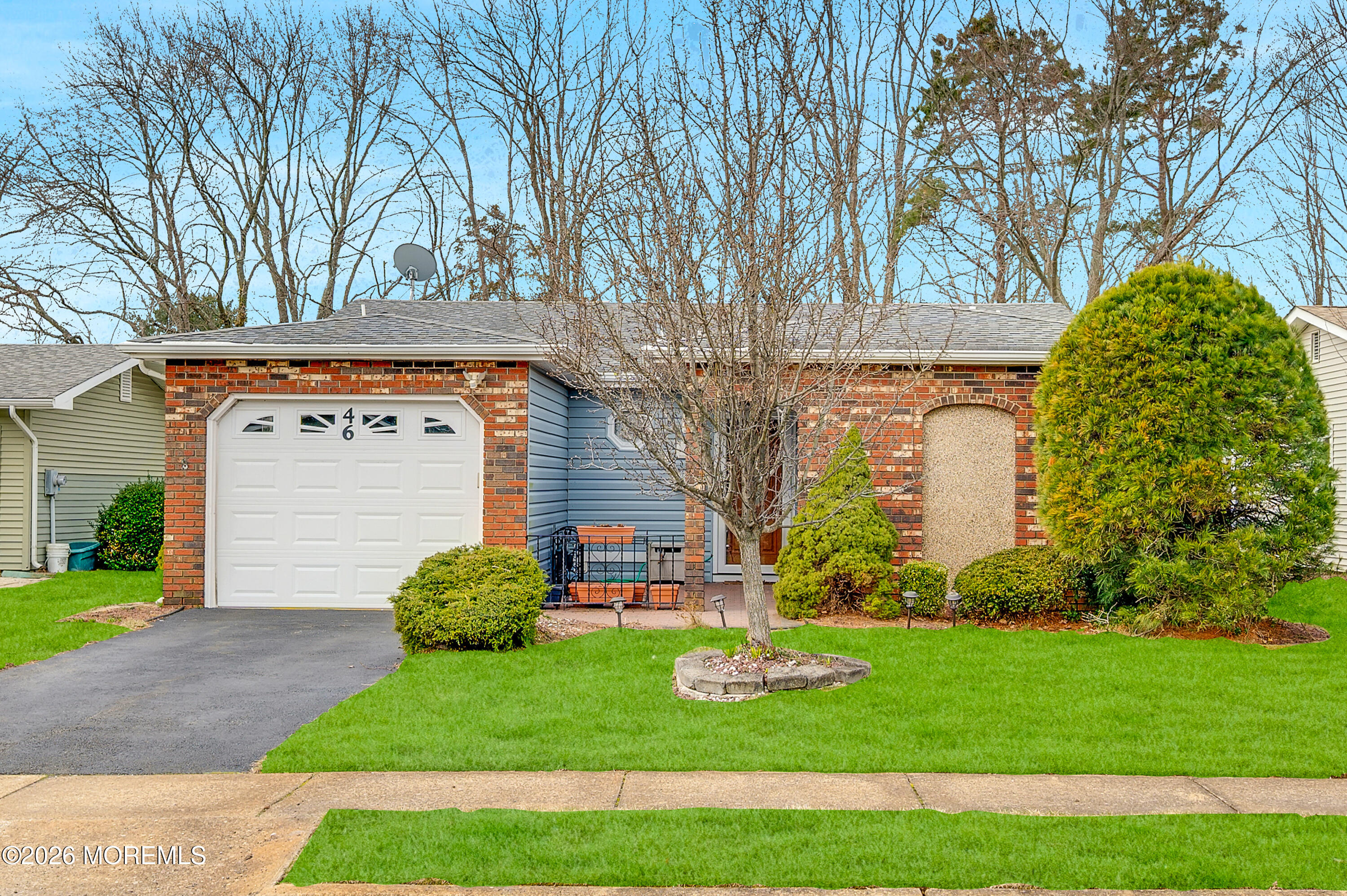 46 Baser Lane Brick, NJ 08724 - Photo 1 of 31 a view of a house with a large tree and plants
