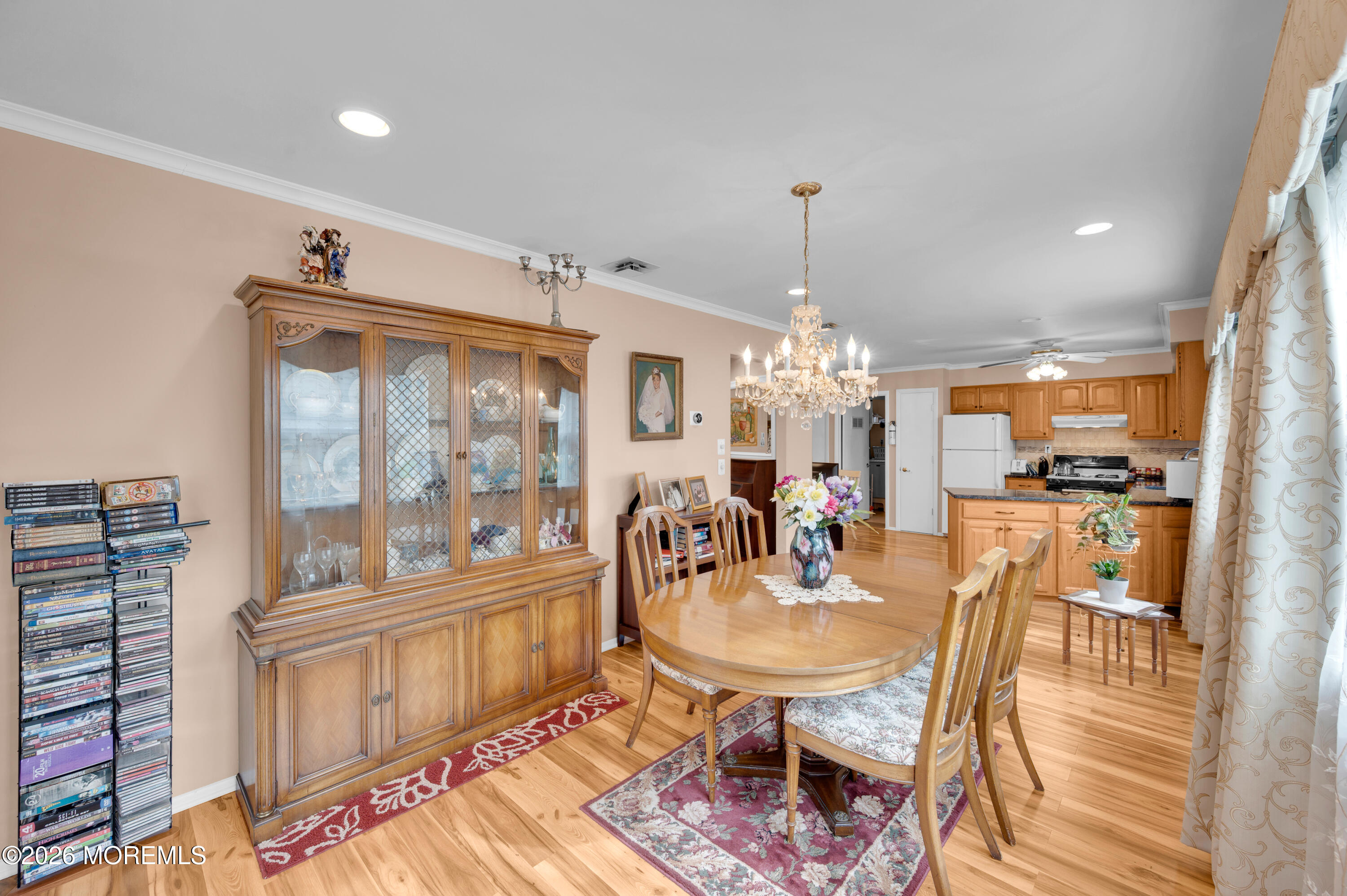 46 Baser Lane Brick, NJ 08724 - Photo 15 of 31 a dining room with furniture a chandelier and wooden floor