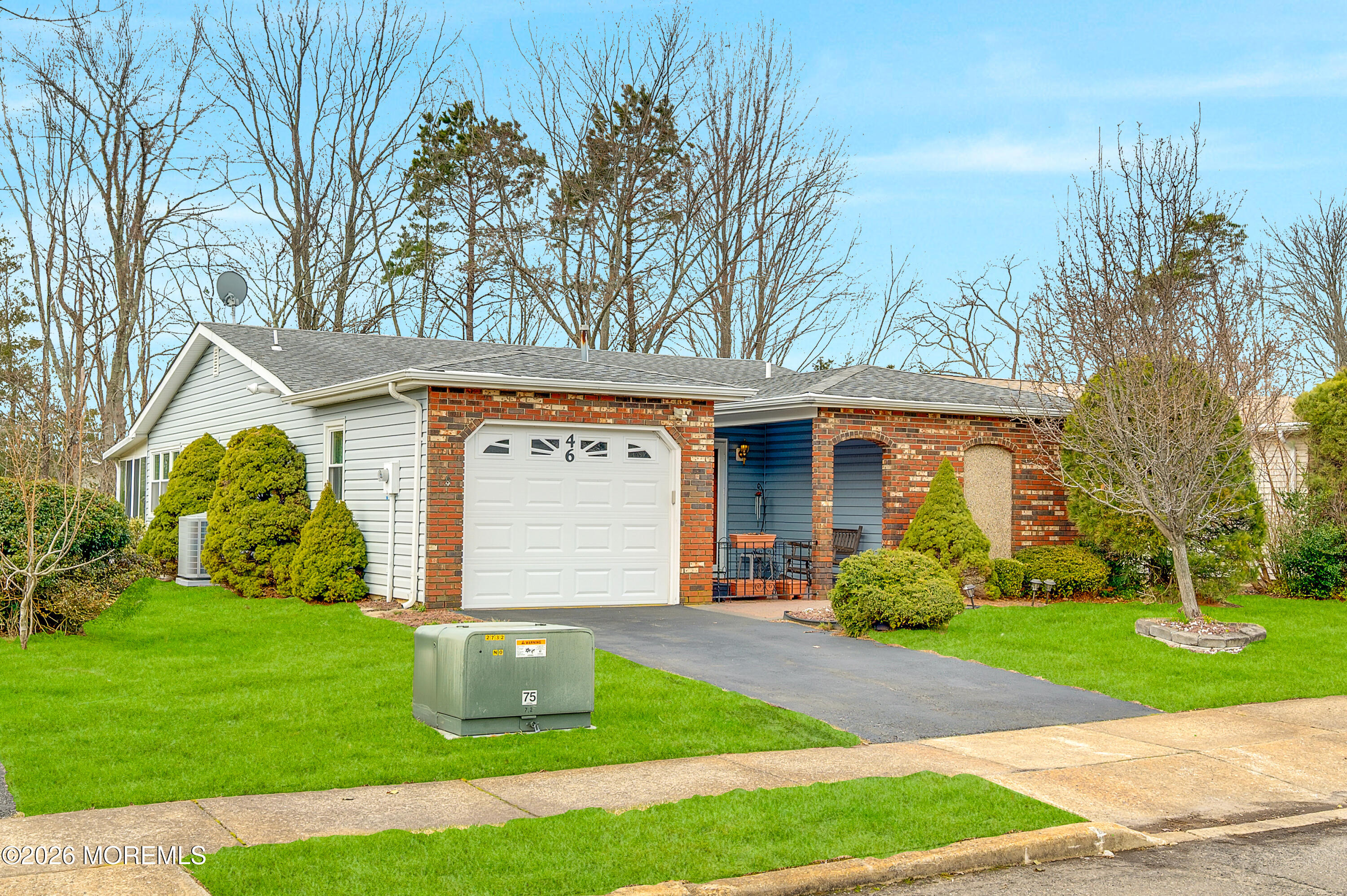 46 Baser Lane Brick, NJ 08724 - Photo 2 of 31 a front view of a house with garden