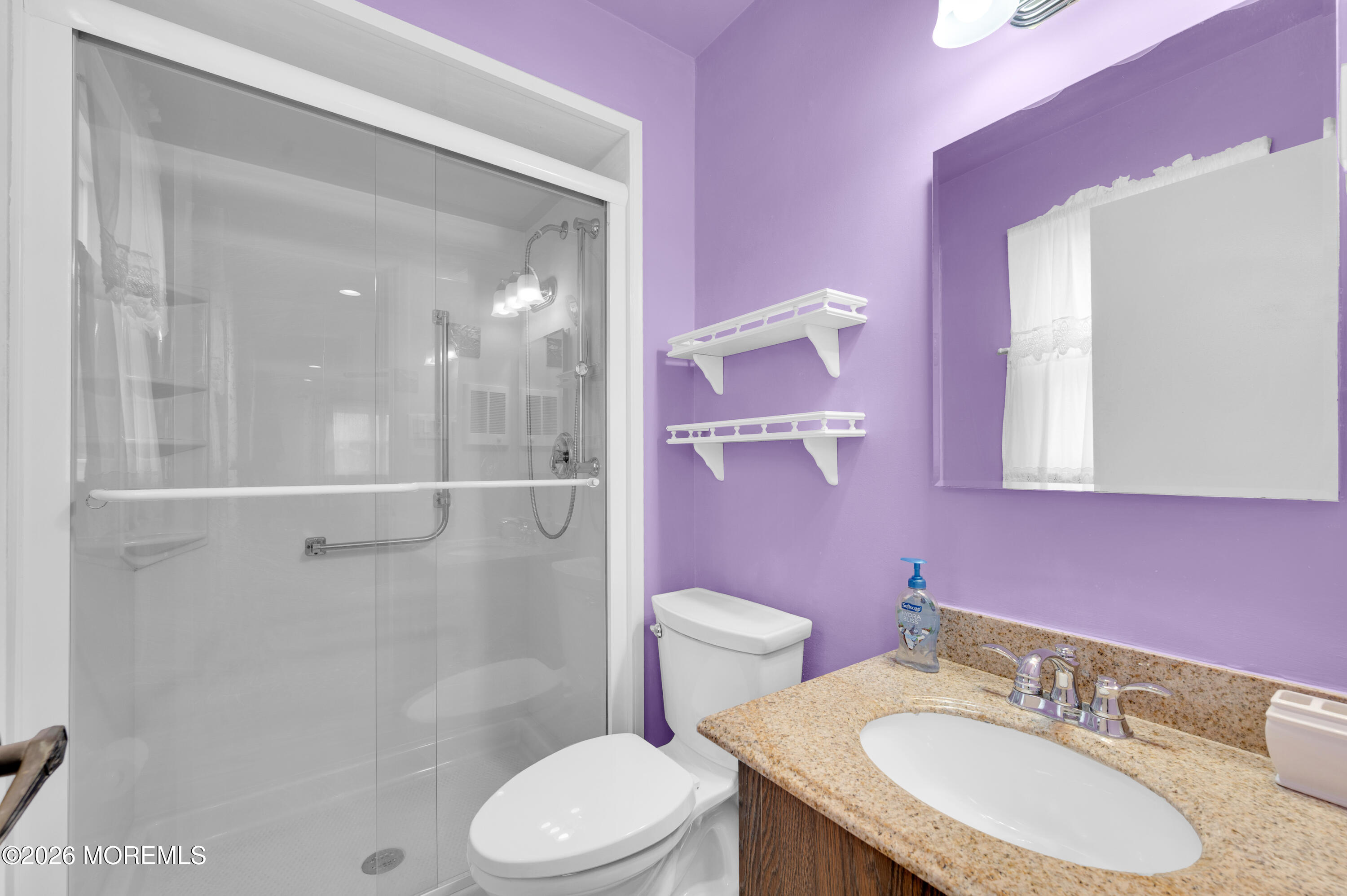 46 Baser Lane Brick, NJ 08724 - Photo 21 of 31 a bathroom with a granite countertop sink toilet a mirror and shower