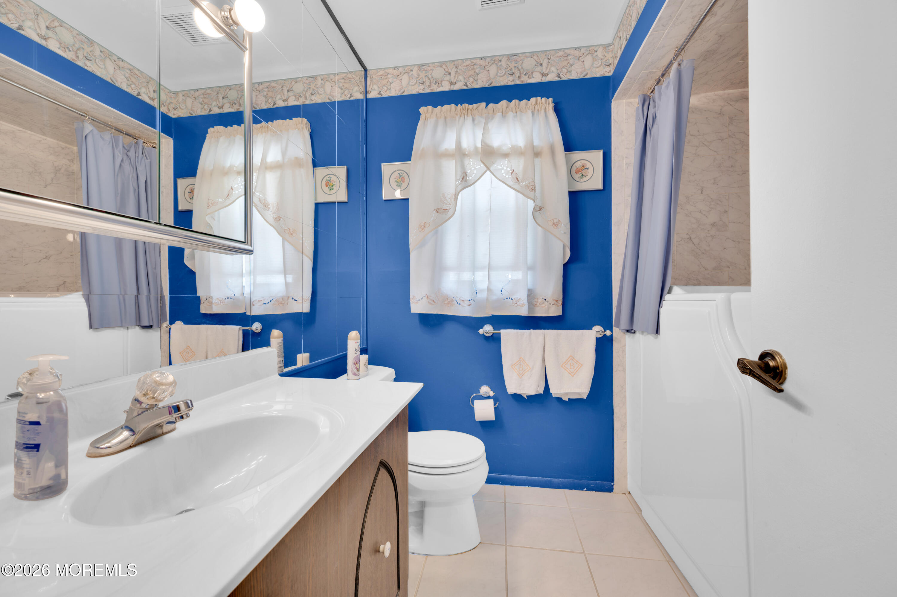 46 Baser Lane Brick, NJ 08724 - Photo 23 of 31 a bathroom with a sink toilet and mirror