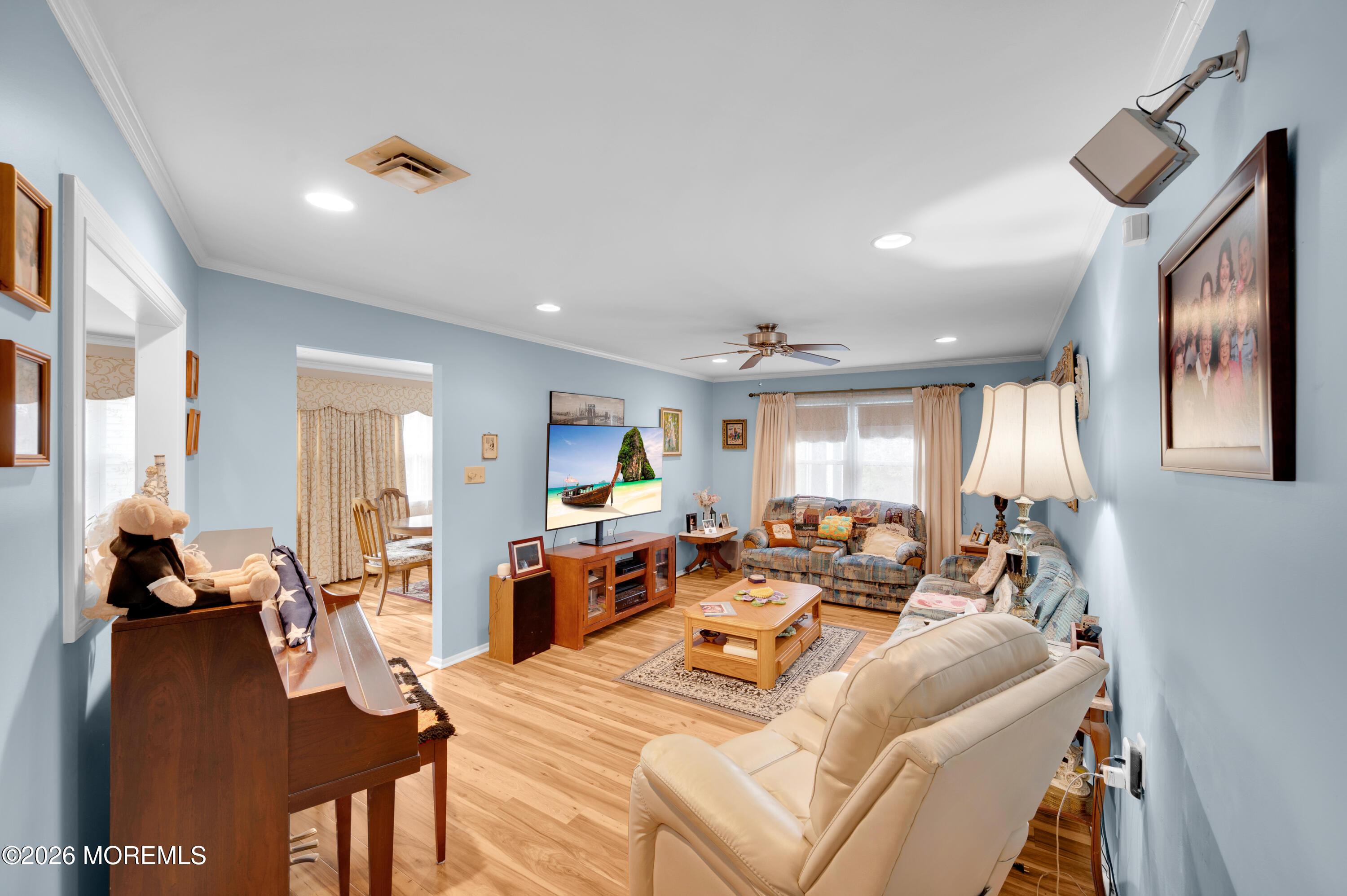 46 Baser Lane Brick, NJ 08724 - Photo 6 of 31 a living room with furniture two large window and a wooden floor