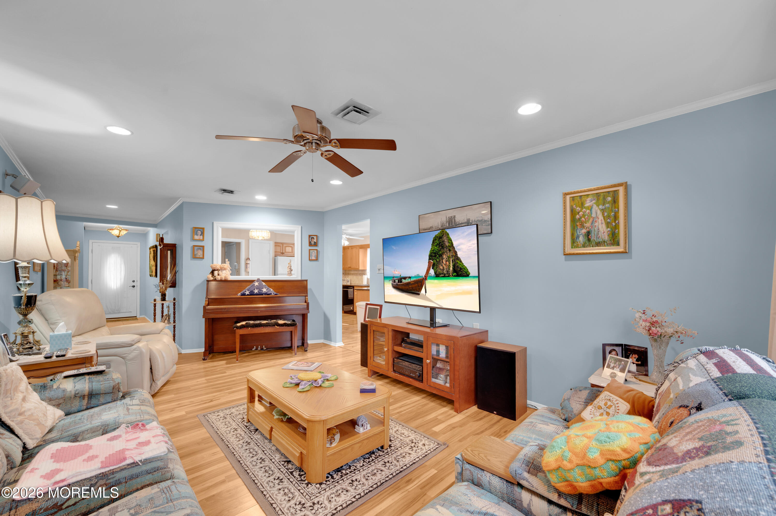 46 Baser Lane Brick, NJ 08724 - Photo 8 of 31 a living room with furniture a flat screen tv and a window