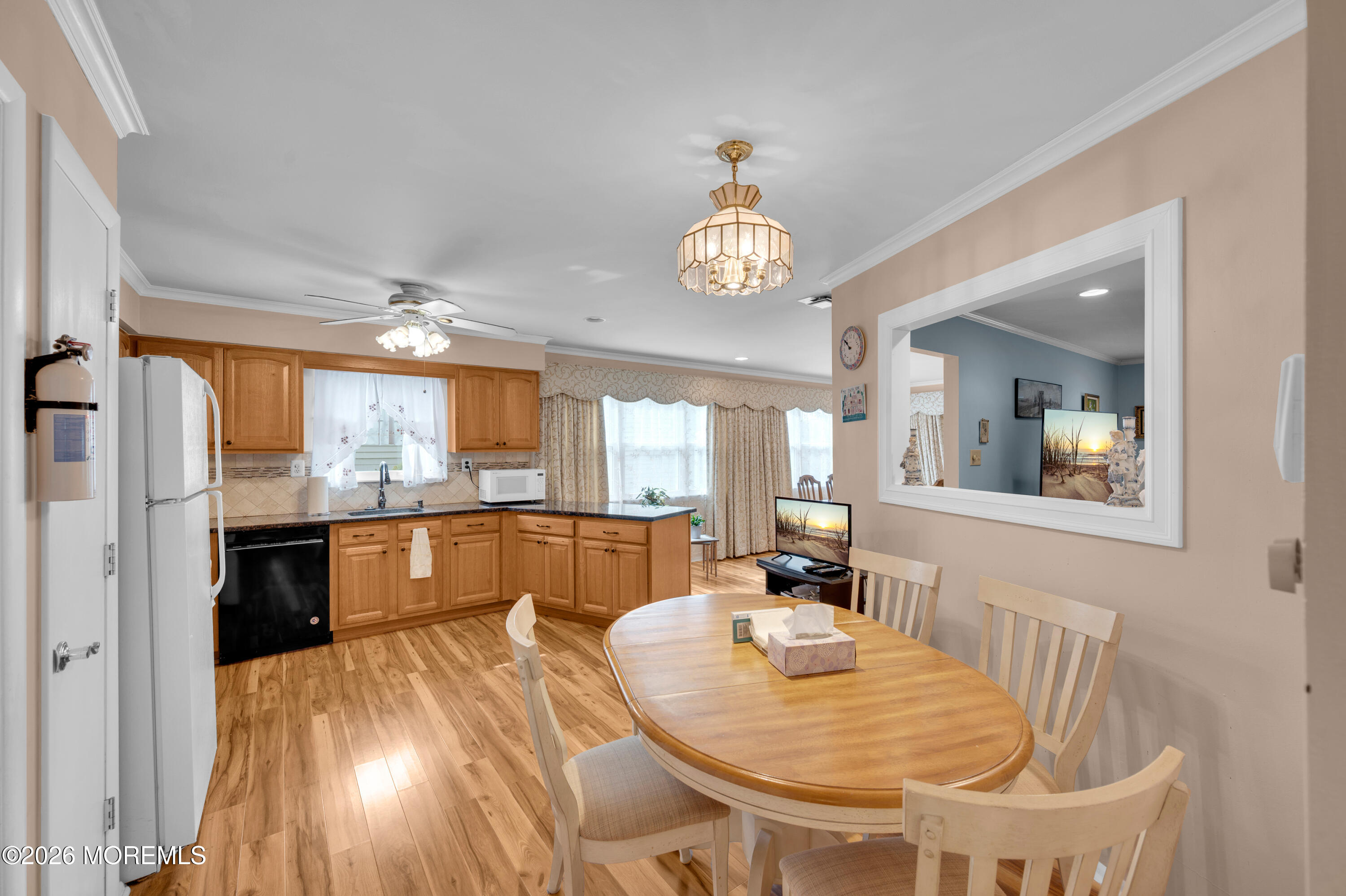 46 Baser Lane Brick, NJ 08724 - Photo 9 of 31 a view of a dining room with furniture wooden floor and chandelier