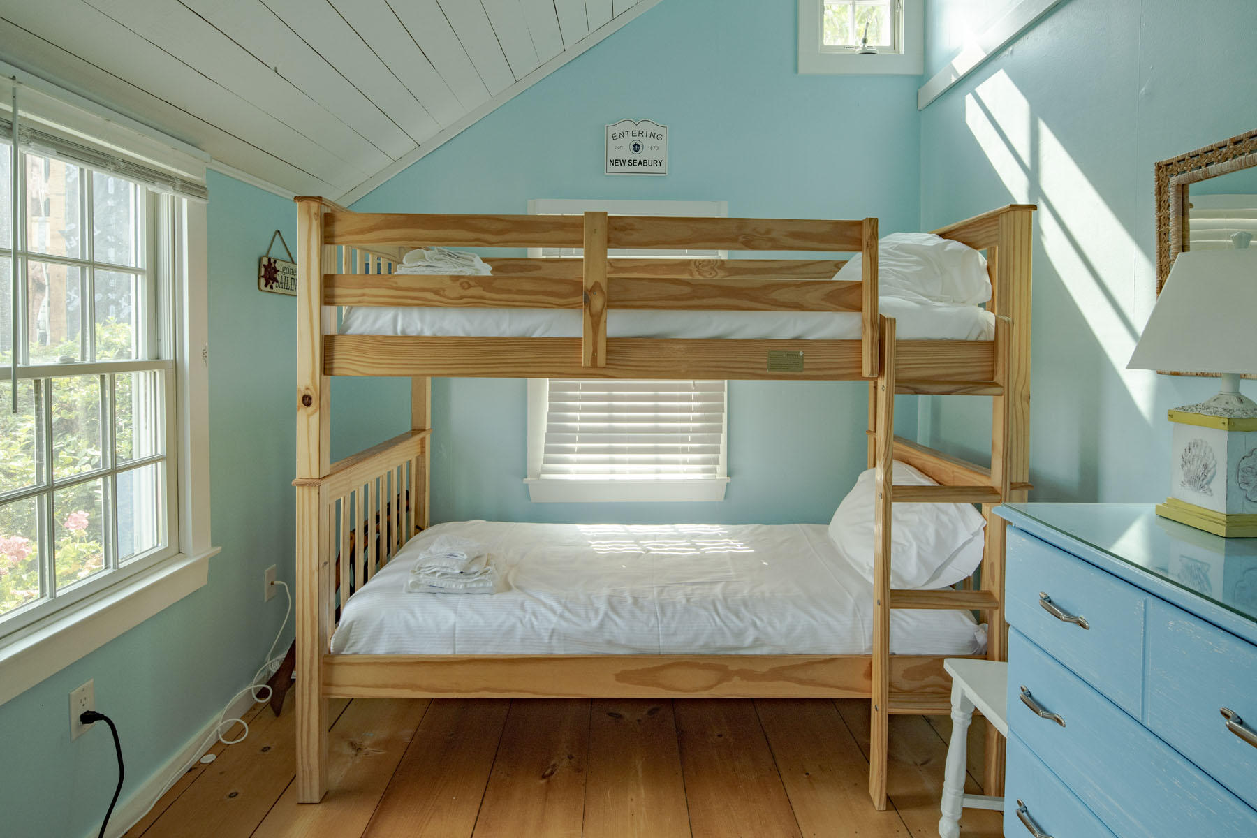 14 Race Point Road Mashpee, MA 02649 - Photo 15 of 18 a bedroom with a bed and windows