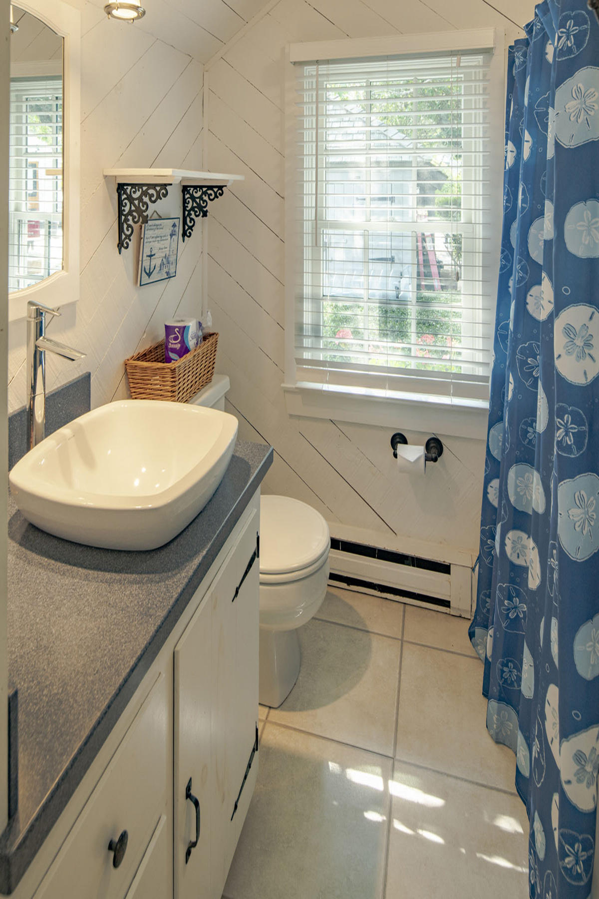 14 Race Point Road Mashpee, MA 02649 - Photo 16 of 18 a bathroom with a granite countertop sink mirror vanity and toilet