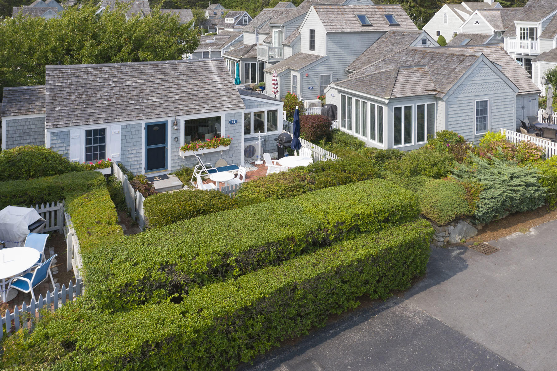 14 Race Point Road Mashpee, MA 02649 - Photo 17 of 18 an aerial view of a house with swimming pool and garden