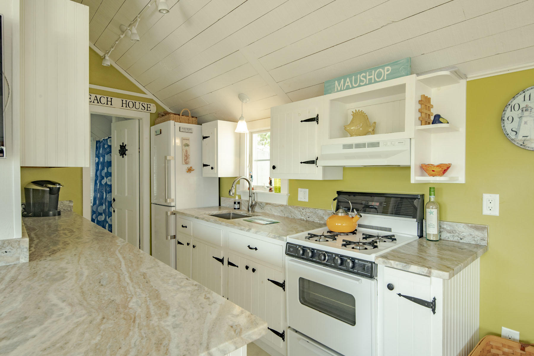 14 Race Point Road Mashpee, MA 02649 - Photo 2 of 18 a kitchen with stainless steel appliances a stove a sink and a refrigerator