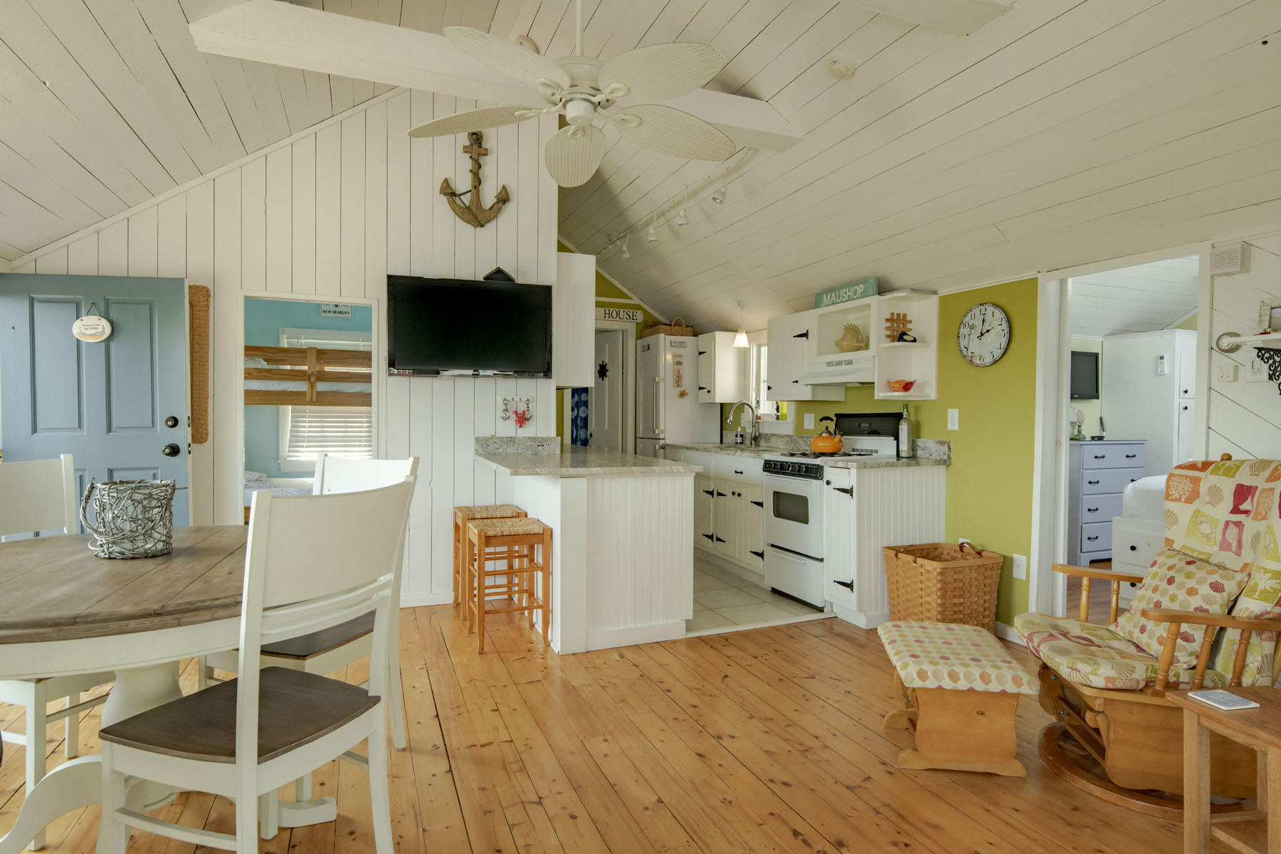 14 Race Point Road Mashpee, MA 02649 - Photo 5 of 18 a living room with furniture and a flat screen tv