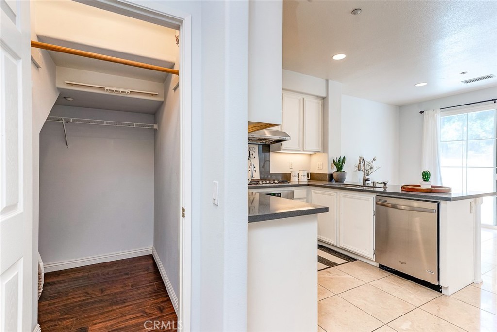 38 Daisy Irvine, CA 92618 - Photo 15 of 41 a kitchen with white cabinets and white appliances